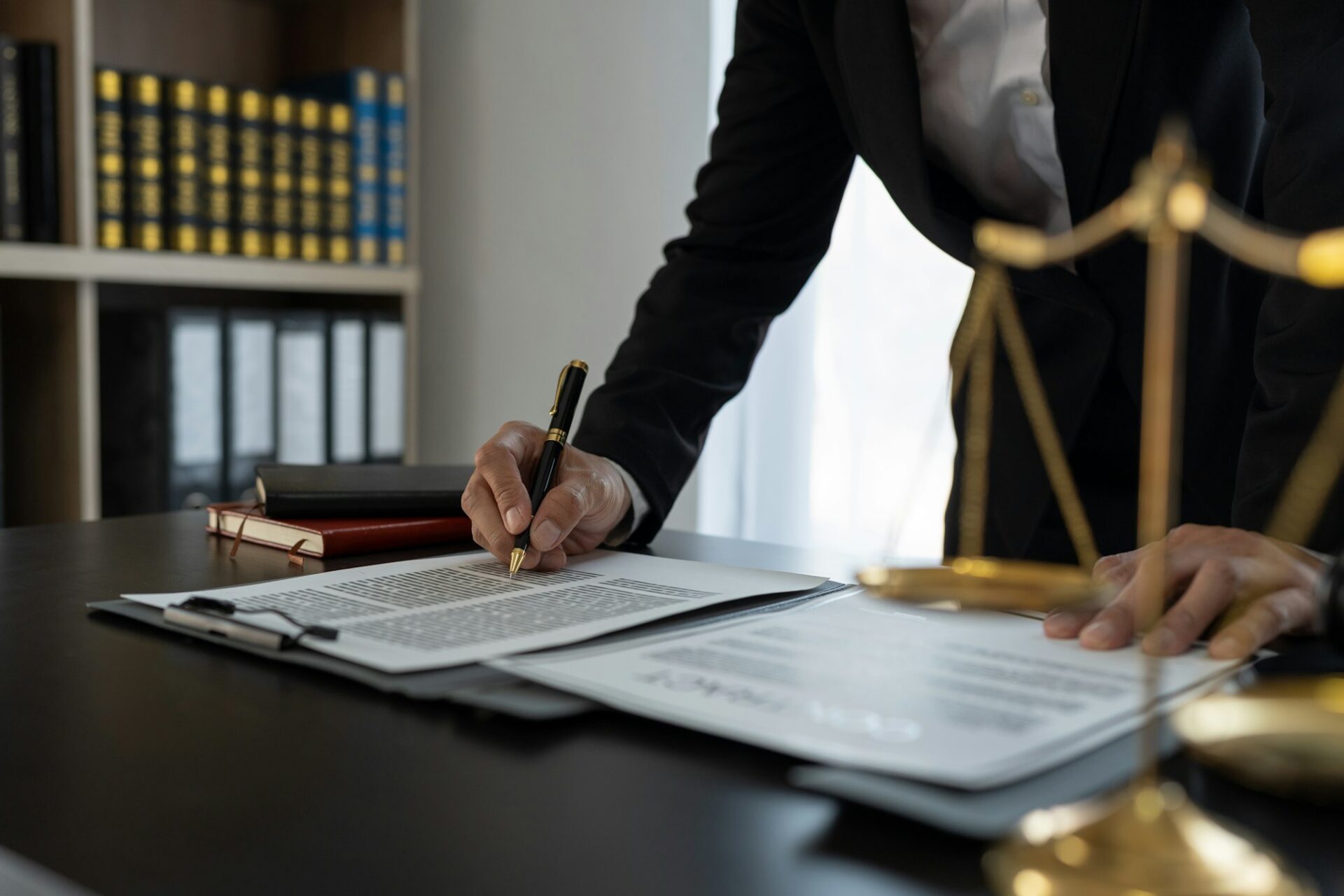 Confident lawyer or businessman examining details in real estate legal contract document Legal servi