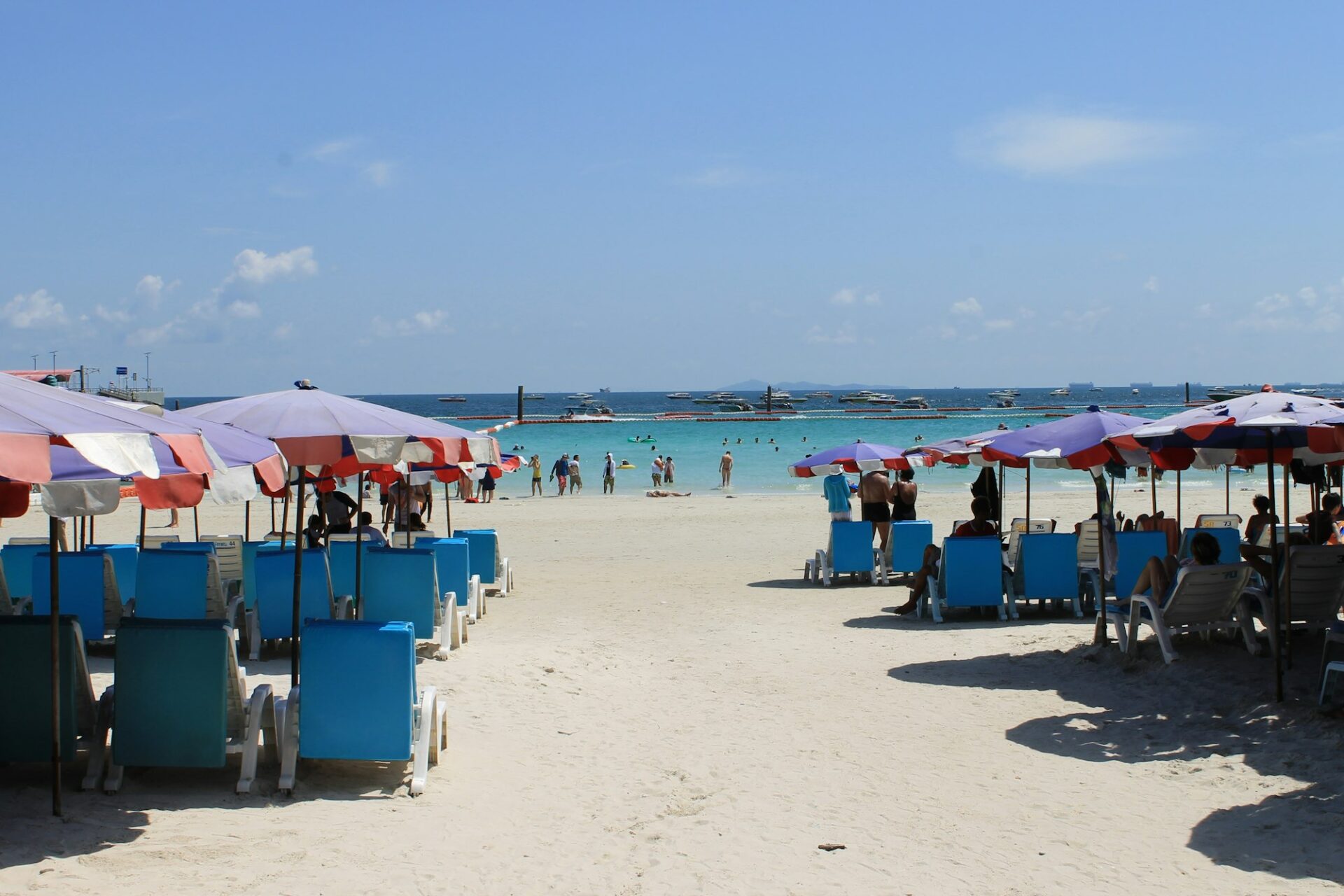 Koh Larn island, Pattaya, Thailand. Many people are on the beach.