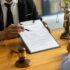 Legal consulting services, legal negotiations, Lawyer are signing legal contract agreement document.