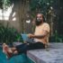 Portrait of Caucasian programmer with laptop keeping freelance digital nomad lifestyle