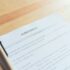 closeup of signing a documentation agreement and pen on the table.