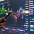 Digital graph chart diagrams of cryptocurrency, stock market or forex exchange on computer screen.