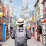 traveler walking at Chinatown street market in Singapore.
