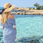 Woman at the beach in Cyprus. Beautiful Summer seaside view